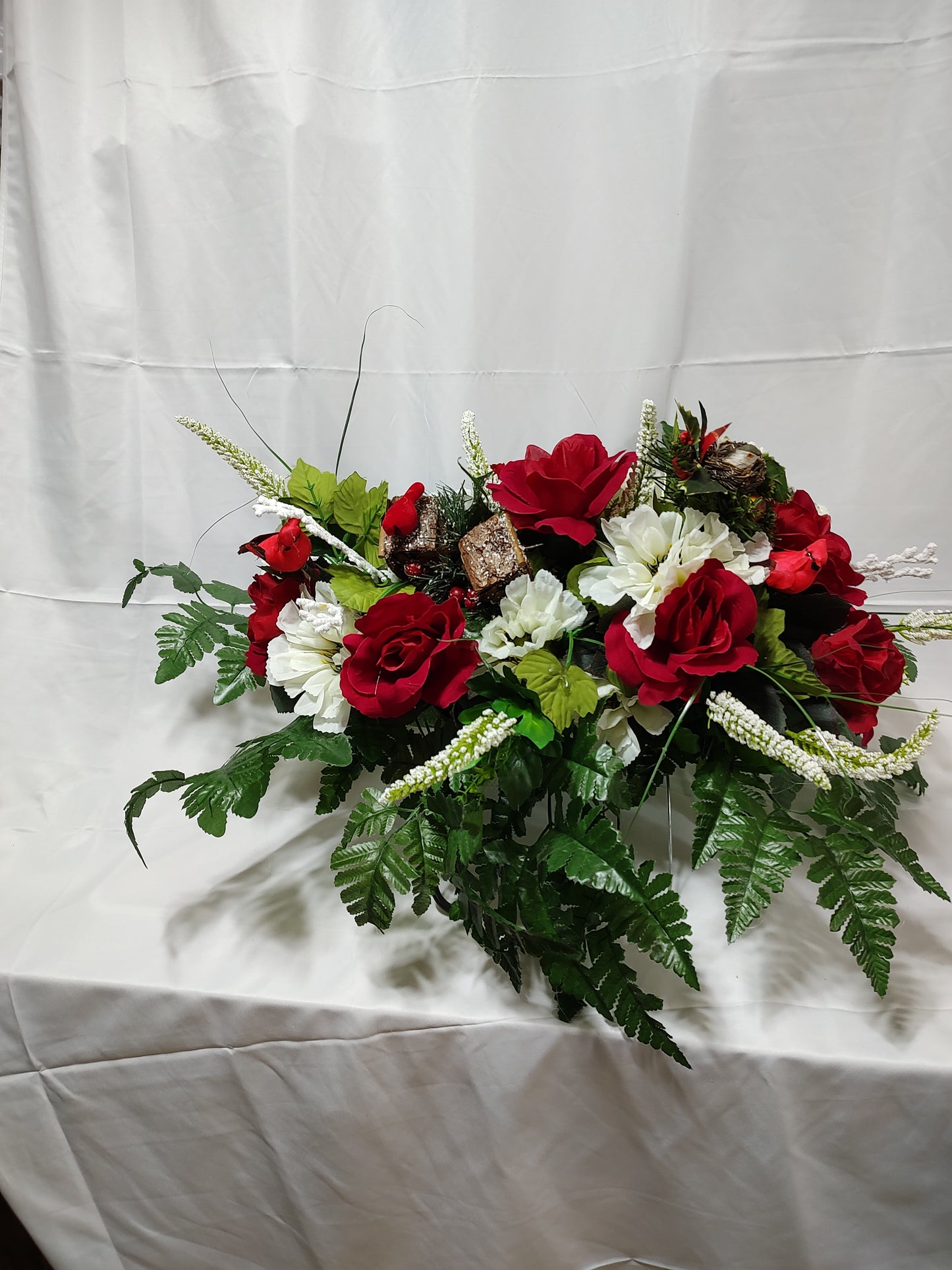 Red and white winter cemetery grave saddle