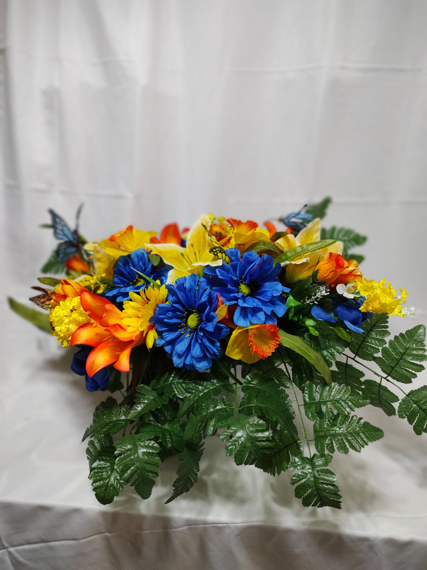 Blue, yellow and orange spring cemetery grave saddle