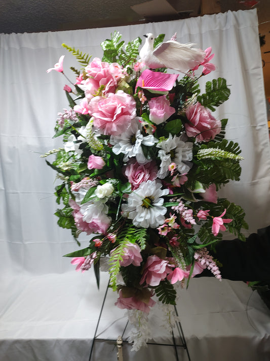 Pink and white sympathy funeral arrangement spray with dove