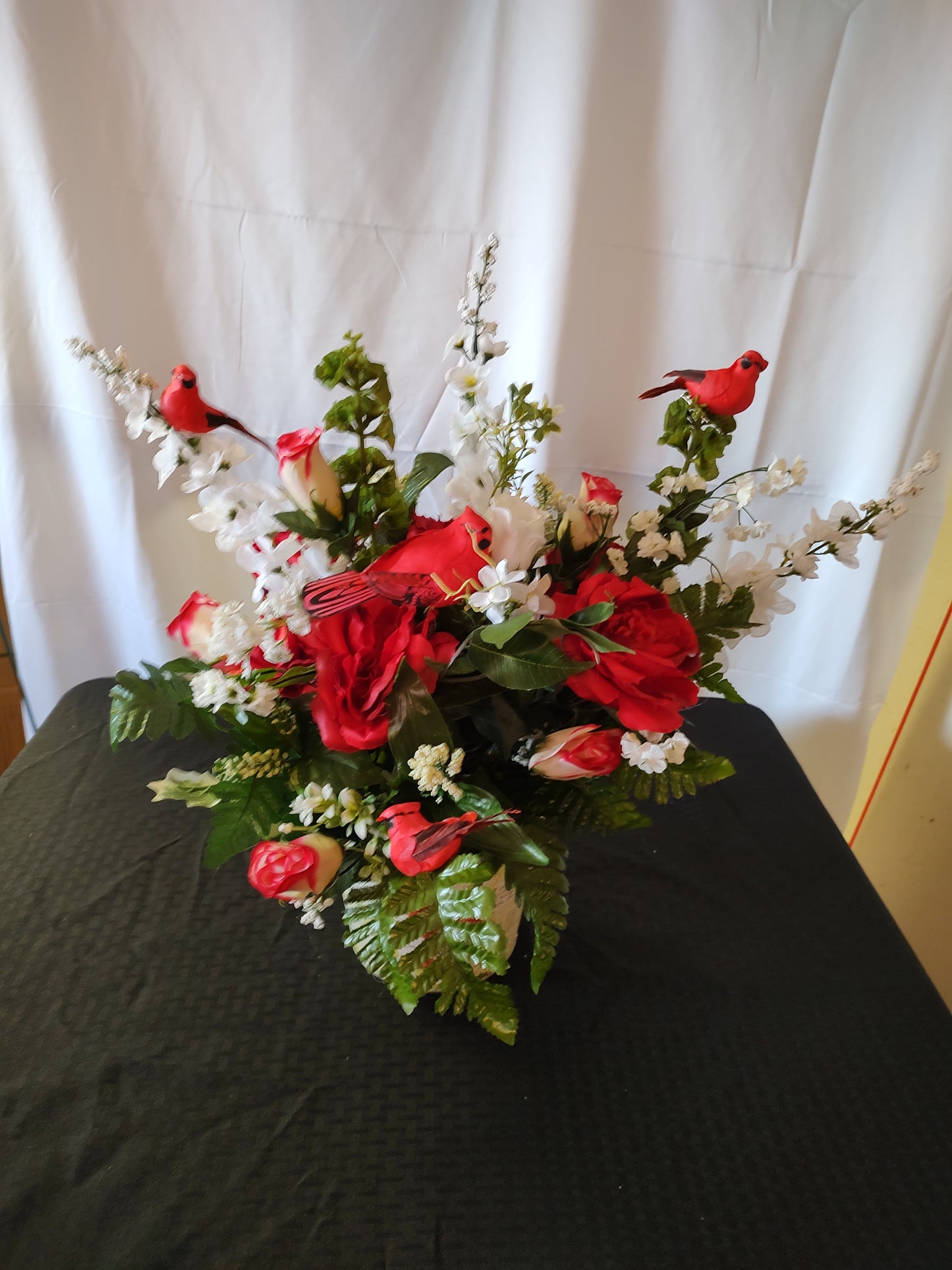 Cardinal and rose arrangement