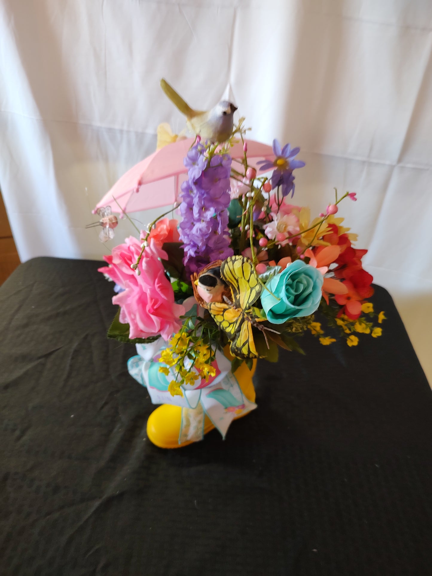 Spring rain boot umbrella centerpiece arrangement